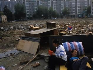 Φωτογραφία για Περίπου 1.000 Κινέζοι εμπλέκονται σε σκάνδαλο κακοδιαχείρισης χρημάτων για φτωχούς