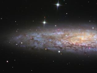 Φωτογραφία για NGC 253: Ένα λαμπερά σκονισμένο Αστέρι του Διαστήματος