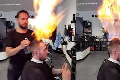 Τι κάνει ο παλαβιάρης;...Κομμωτής χρησιμοποιεί φωτιά για να χτενίσει τα μαλλιά των πελατών του