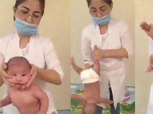 Φωτογραφία για Ανατριχιαστικό: Γυναίκα περιστρέφει μωρό από τα χέρια και το κεφάλι του για να του κάνει μασάζ [video]