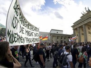 Φωτογραφία για Γερμανία: Διαδηλώσεις κατά της χρήσης μάσκας