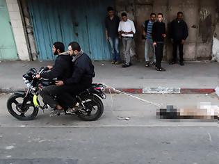Φωτογραφία για Σκληρά βίντεο (2): Παλαιστίνιοι εκτελούν σέρνοντας πίσω από μηχανάκια υπόπτους για κατασκοπία!!! (Προσοχή: Σκληρές εικόνες)