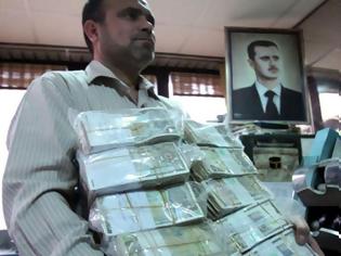 Φωτογραφία για «Τόνους» χρημάτων έστειλε η Μόσχα στην Συρία για την ενίσχυση του Assad
