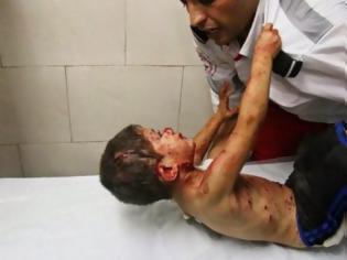 Φωτογραφία για Η ιστορία πίσω από τη συγκλονιστική φωτογραφία του αγοριού από τη Γάζα...