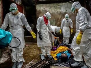 Φωτογραφία για Φωτογραφίες γροθιά στο στομάχι κατέγραψε με το φακό του φωτορεπόρτερ  στη Λιβερία που δοκιμάζεται από το ιό Έμπολα (Pics)