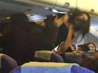 Φωτογραφία για Κίνα: Σε ρινγκ μετατράπηκε αεροπλάνο εν πτήσει εξαιτίας ενός μωρού που έκλαιγε
