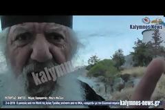 Ο μοναχός από την Μονή της Αγίας Τριάδας απέναντι από τα ΙΜΙΑ, που χαιρετά με την Ελληνική σημαία τα διερχόμενα σκάφη. (video)